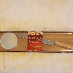 Bread board with dipping bowl and knife